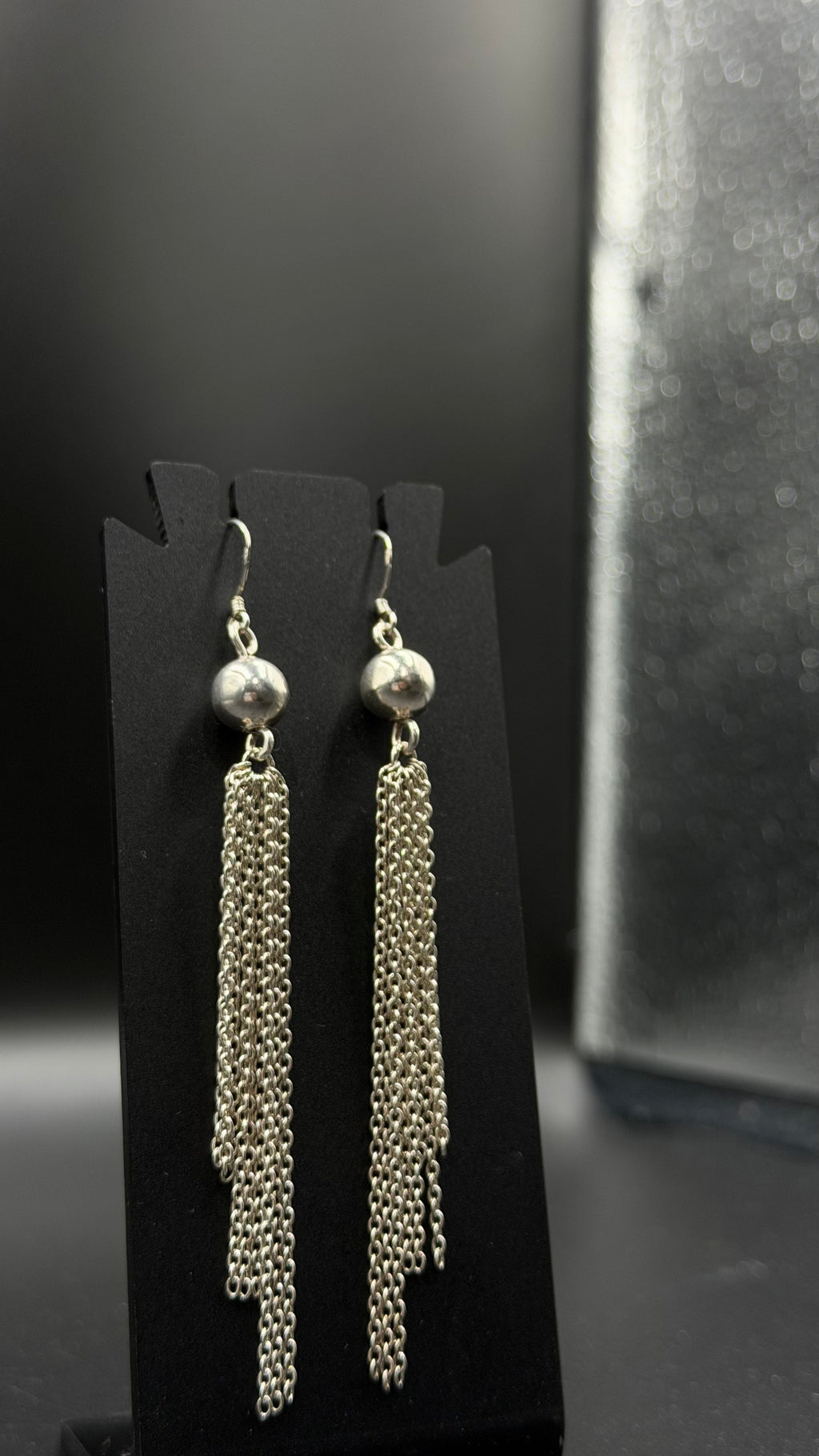 silver ball long earrings